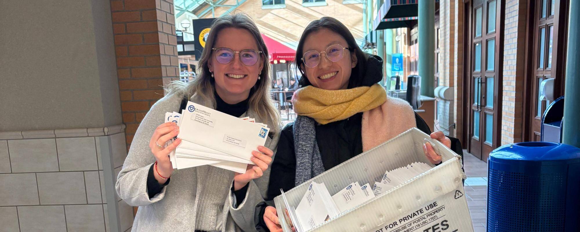 Female staff members at the post office sending out promotionals